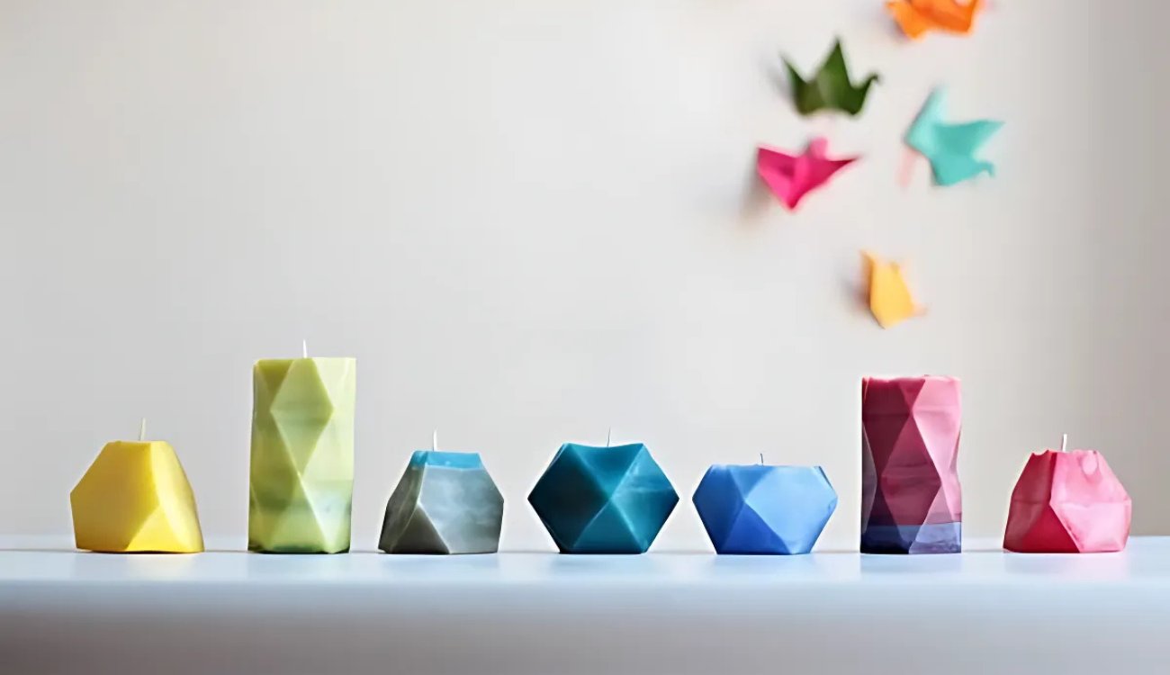 Handmade geometric pillar candles from SPM Shop, showcasing unique designs that enhance home decor with elegance and artistry.